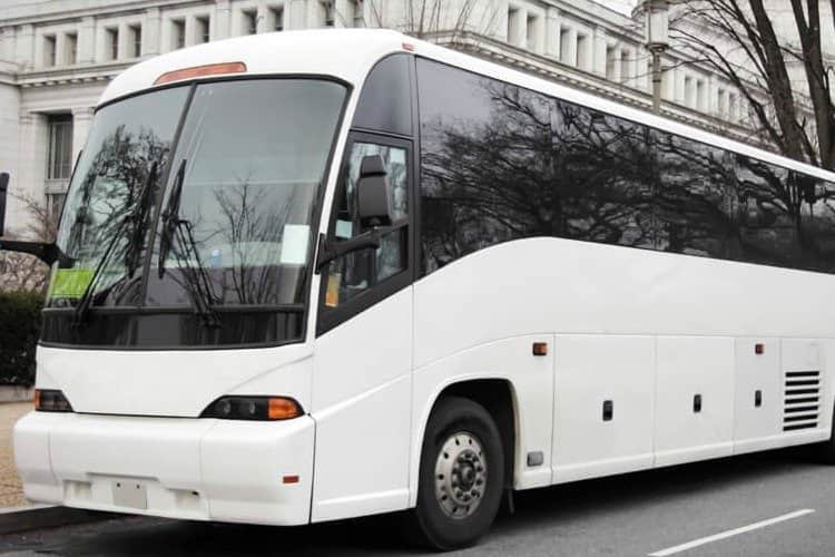 A white charter bus rental
