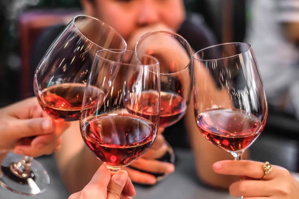 friends toast their wine glasses at a san francisco winery