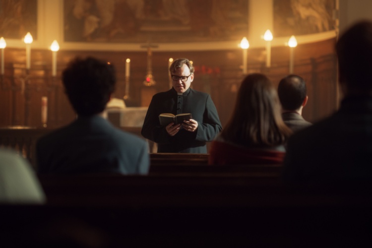 a congregation sits during mass