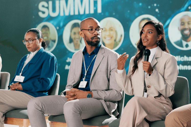 a group of speakers at a convention