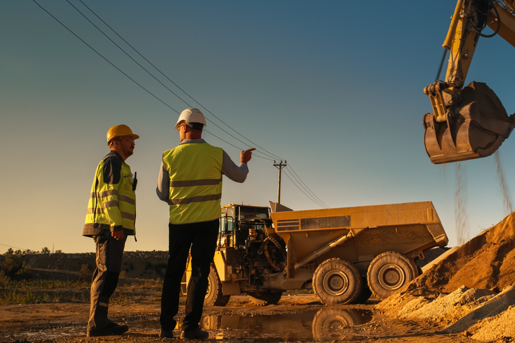 two workers on a construction worksite
