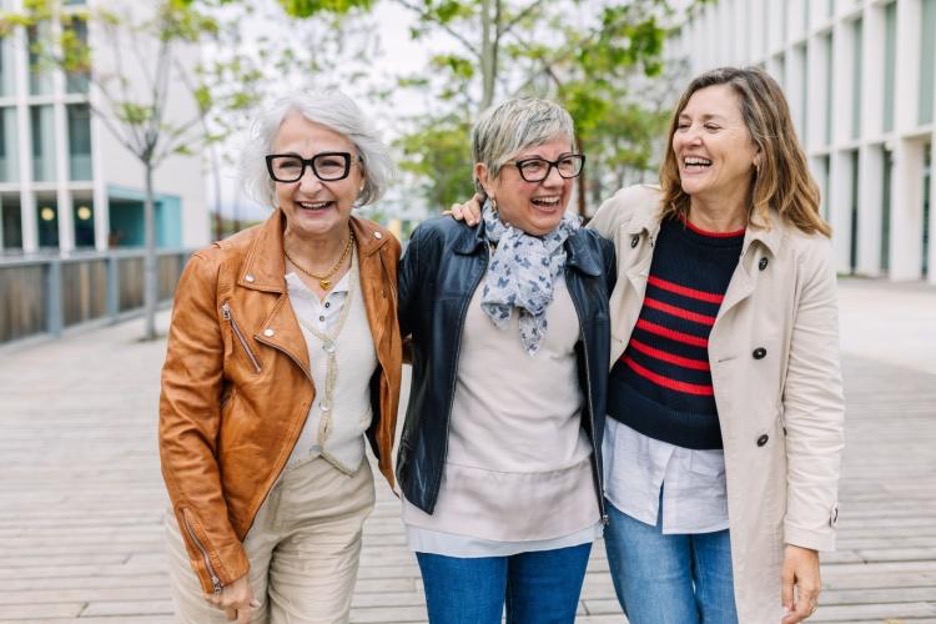 friends smiling while exploring a city