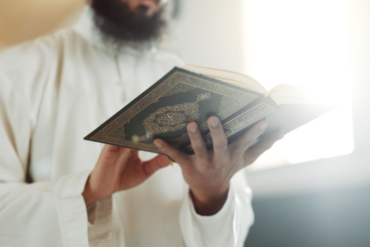 a man reads from the Quran