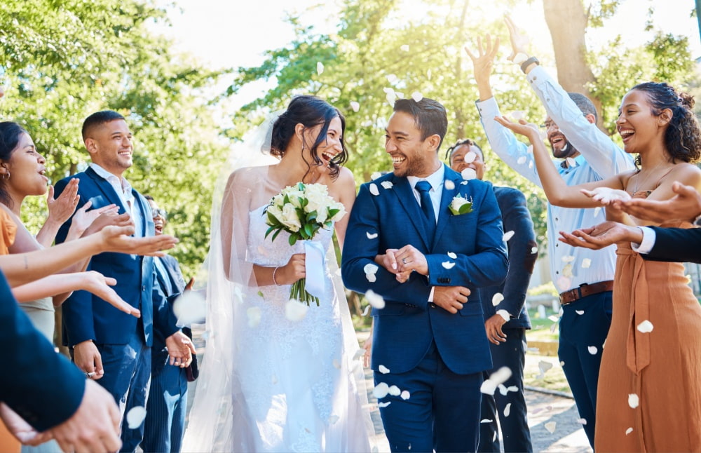 a couple smiles during their exit at their wedding ceremony