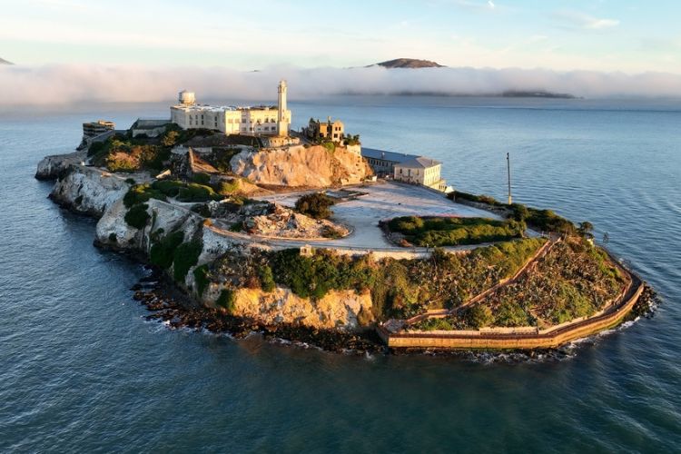 An aerial view of Alcatraz Island at sunset