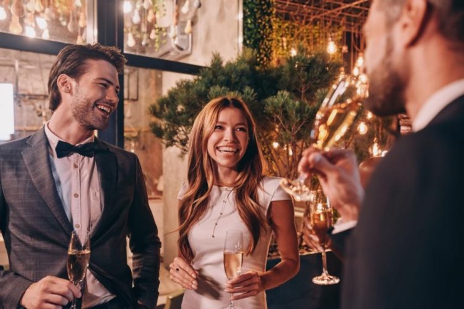 wedding guests smile during a reception