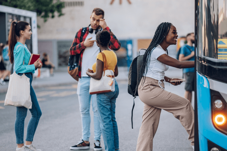 friends boarding a charter bus