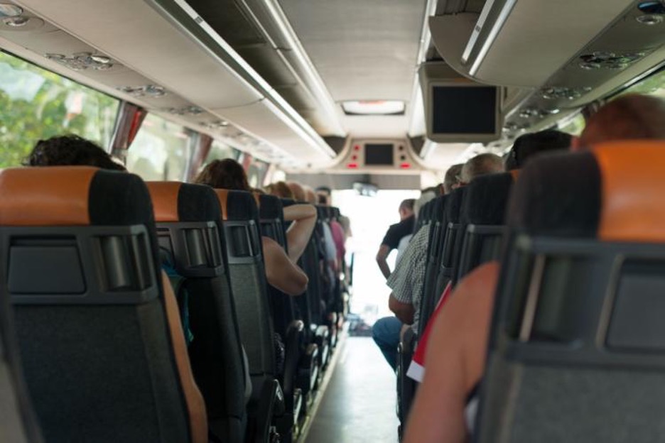passengers sitting on a charter bus