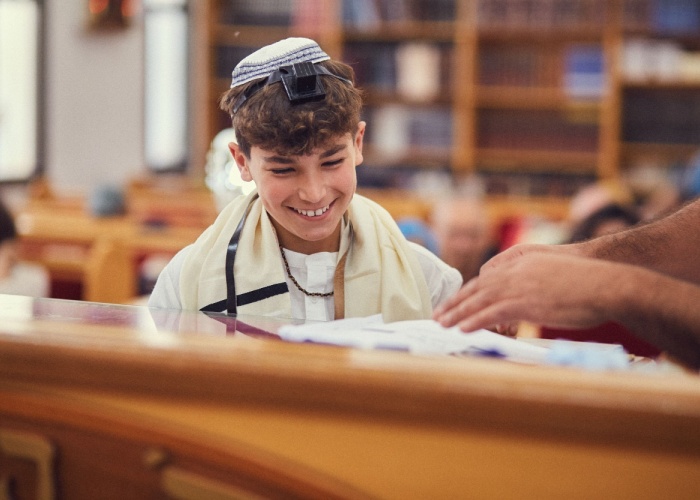 a young jewish boy studies the torah