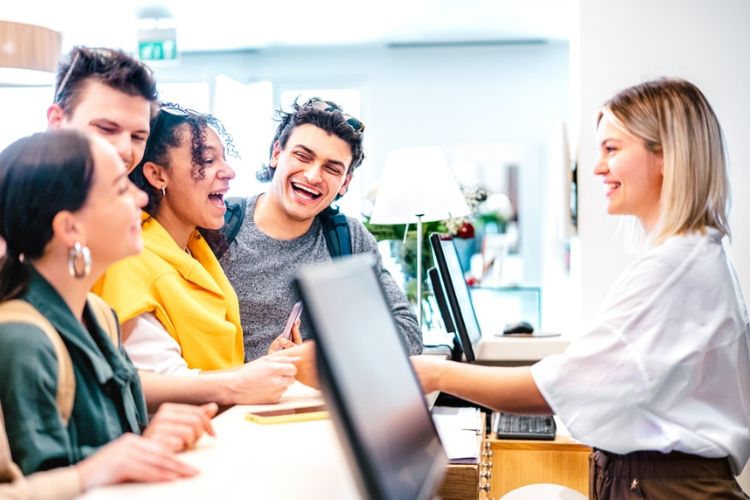 a group of friends checking in at a hotel