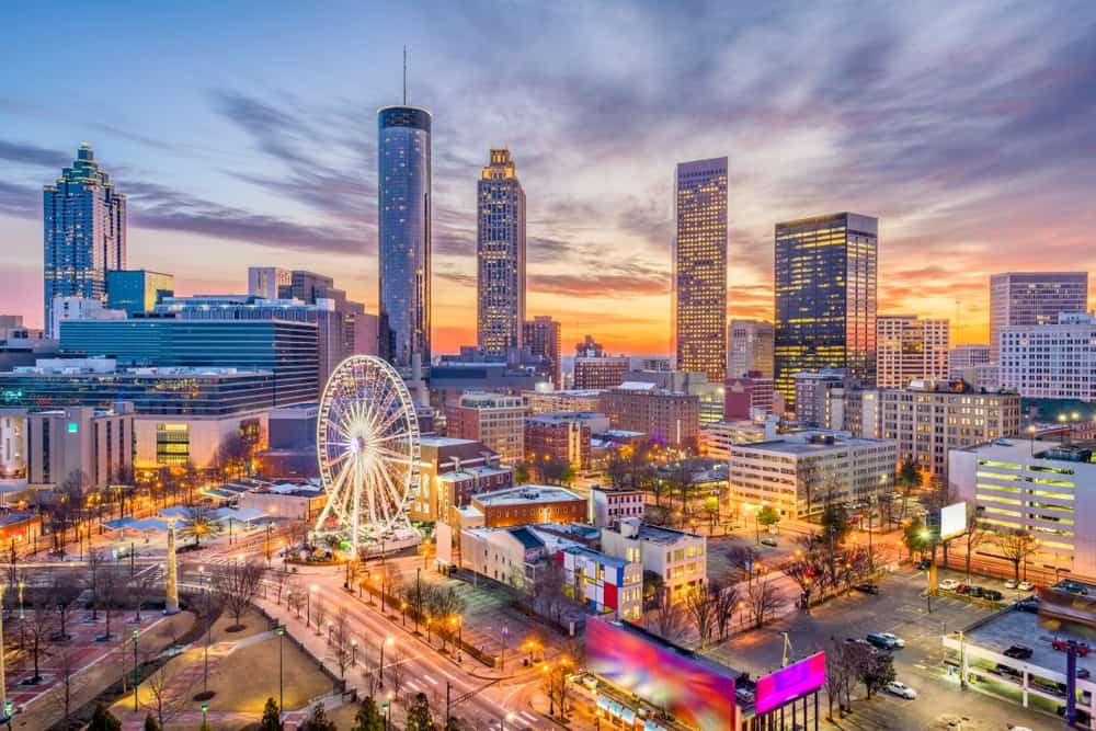 a view of the ferris wheel, the westin, and other atlanta skyline highlights at dusk
