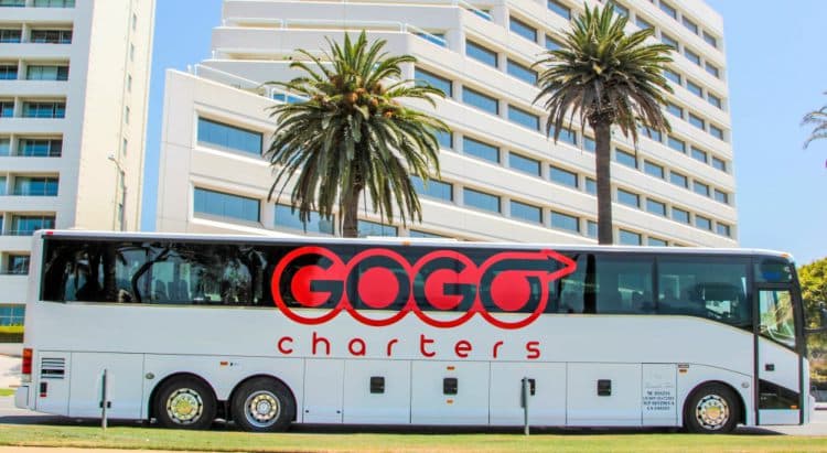 gogo charters bus parked on a city side street