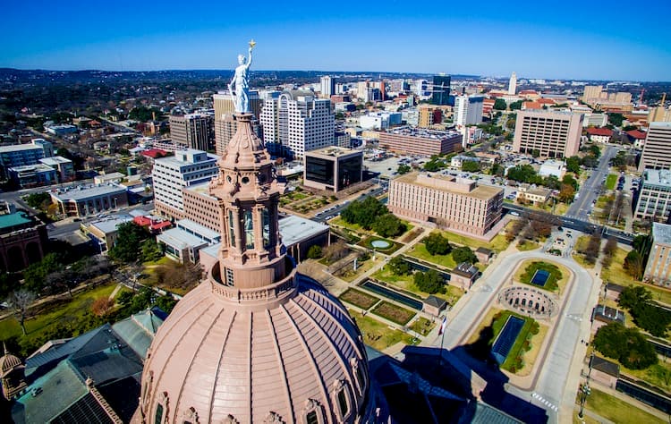 another overview of the texas state capitol, with the rotunda and front pathways