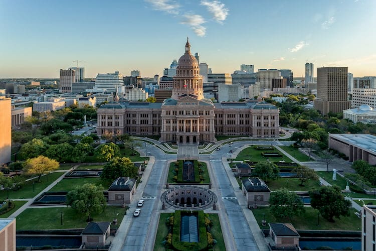 a bird's eye view of the texas state capitol, with a long pathway going to the entrance