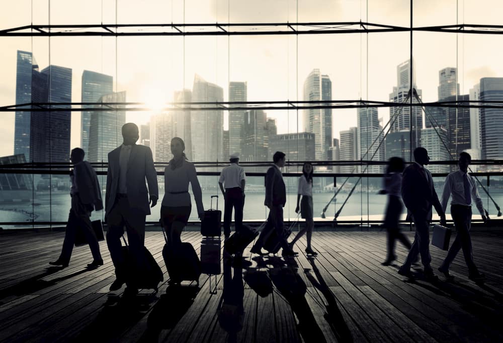 corporate travelers arrive at a business convention