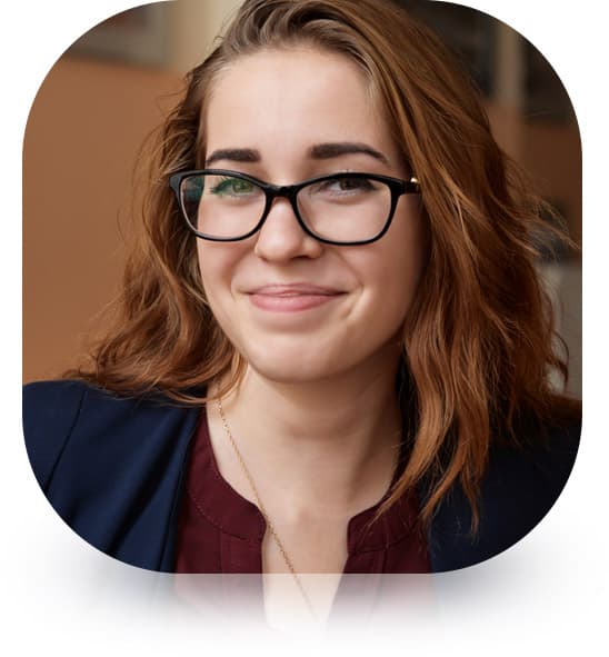 smiling woman with glasses on testimonial